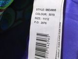 a close up of a label on a purple jacket