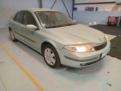 a picture of a car in a garage with a light on