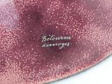 a red plate with a white writing on it