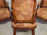 four antique chairs with floral upholstered upholstered cushions