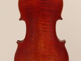 an old violin with a wooden back and a long neck