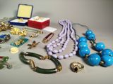 a lot of jewelry sitting on a table together