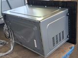 an image of a microwave oven sitting on top of a table
