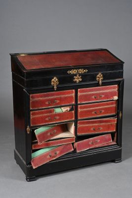 une photo d'une commode noire et rouge