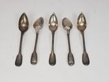 six spoons are lined up on a white surface