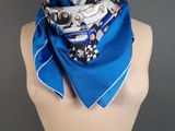a close up of a mannequin torso with a blue scarf on it
