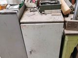 a lot of junk on the floor of a garage