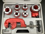 a red pipe cutter and a set of pipe cutters in a case