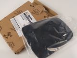 a plastic bag with a black object in it sitting on a table