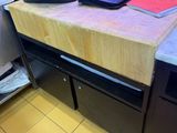 a bag sitting on a counter in a restaurant kitchen