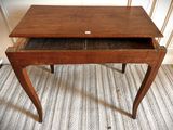 a small wooden table with a drawer underneath it