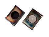 pair of square metal ashtrays on white background with one ashtray in the middle