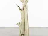 a statue of a woman holding a cell phone in her hand