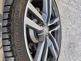 the tire of a car is shown on the side of the road