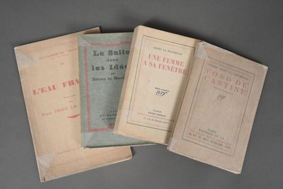 three books sitting on top of each other on top of a table