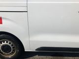 a white van with a red sticker on the side of it