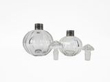 two clear glass vases sitting next to each other