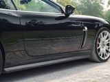 a black sports car parked on the side of the road