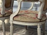 two chairs sitting next to each other on the floor