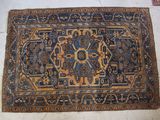 rug on the floor is blue and brown with a pattern
