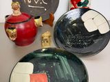 many plates and vases sitting on a table