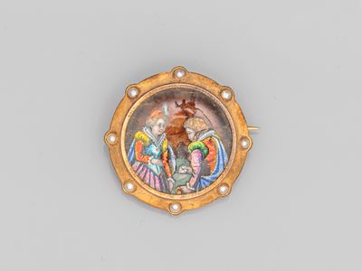 une image représentant une assiette en or sur laquelle figurent un homme et une femme