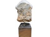 an image of a sculpture of a rock on a wooden base