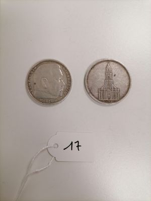 two silver coins with a picture of a church on one side and a smaller one on the other