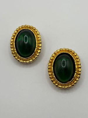 a pair of green and gold earrings