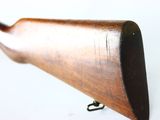 a wooden rifle on a white background with a white background