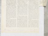 an old newspaper with a piece of paper on top of it next to a pair of scissors