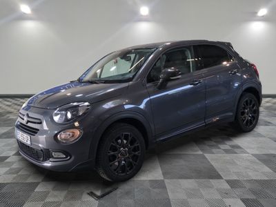 a grey fiat suv parked in a garage with a checkered floor