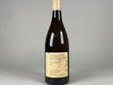 an image of a bottle of wine sitting on top of a table