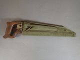 a small green tool that is laying on a table