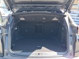 a trunk of a car that is open on the ground
