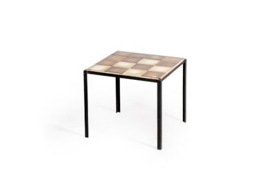 a small table with a tiled top and metal legs