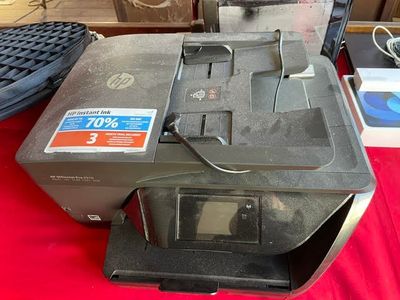 a printer that is sitting on a red table