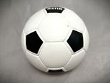 a white and black soccer ball sitting on a table
