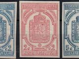 three different stamps of different colors and designs on a black background
