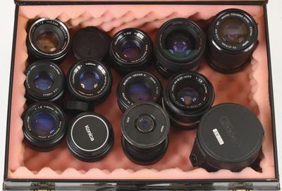 many different lenses in a case on the table