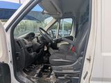 a white van with the door open and the driver ' s seat down