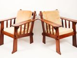 pair of arts and crafts chairs with upholstered cushions