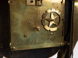 a clock that has a star on the side of it
