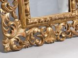 a picture of a gold frame with a mirror in it