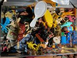 a box full of toys that are sitting on a table