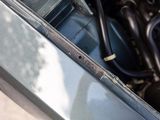 a close up of a car ' s engine with the hood open