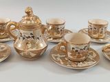 a group of cups and saucers sitting on a table