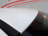 a close up of a white car with a red star on it