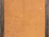 an old picture frame with a piece of brown paper in it
