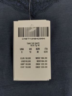 a close up of a label on the back of a shirt